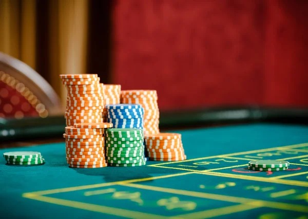 Live blackjack dealer and card table on pokerace studio